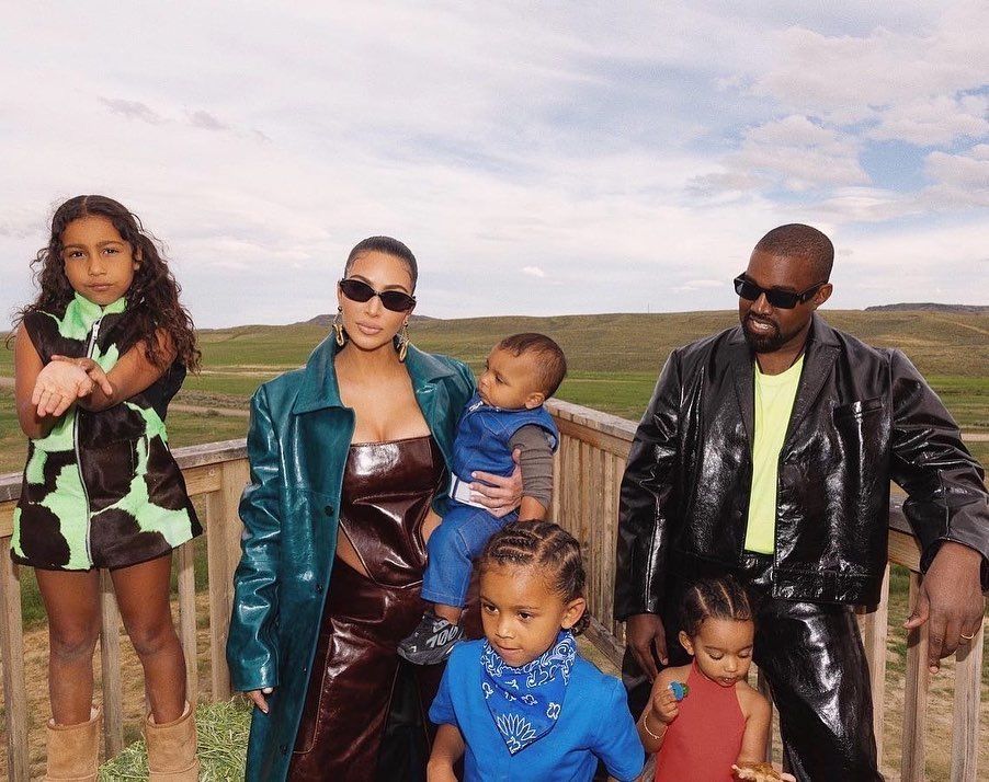 Kim Kardashian and Kanye West with their children