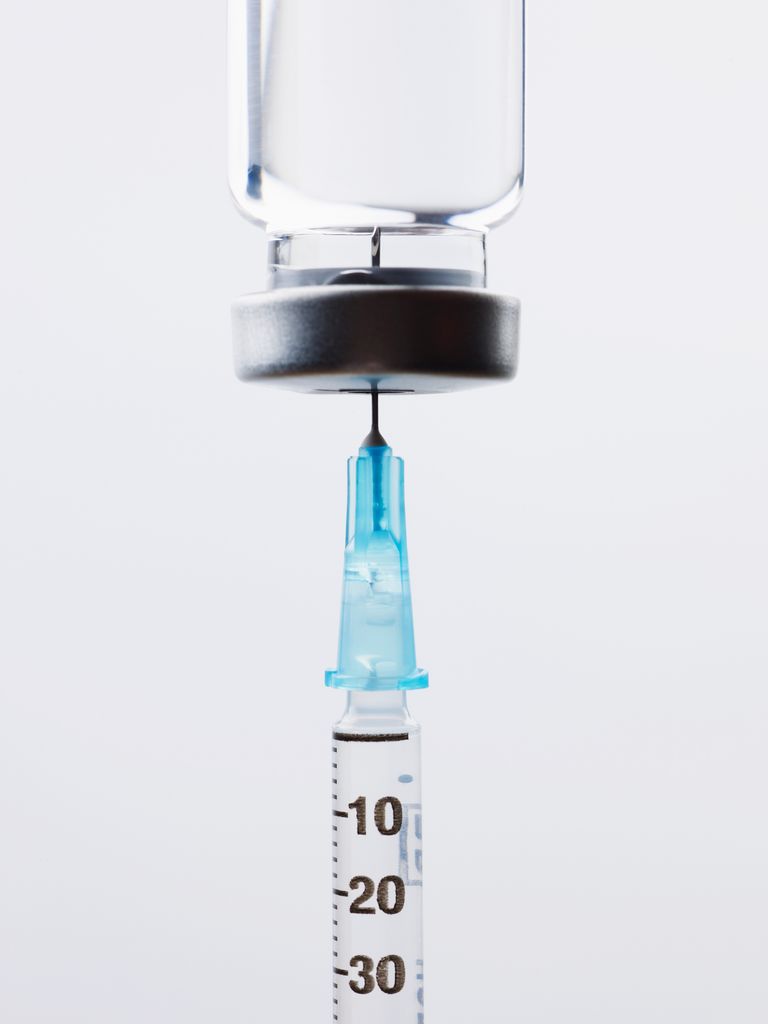 Stock image of injection and liquid bottle