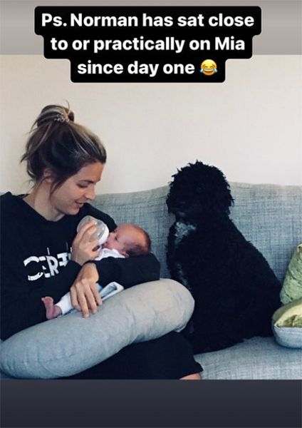 Gemma Atkinson feeding Mia with Norman sat by them