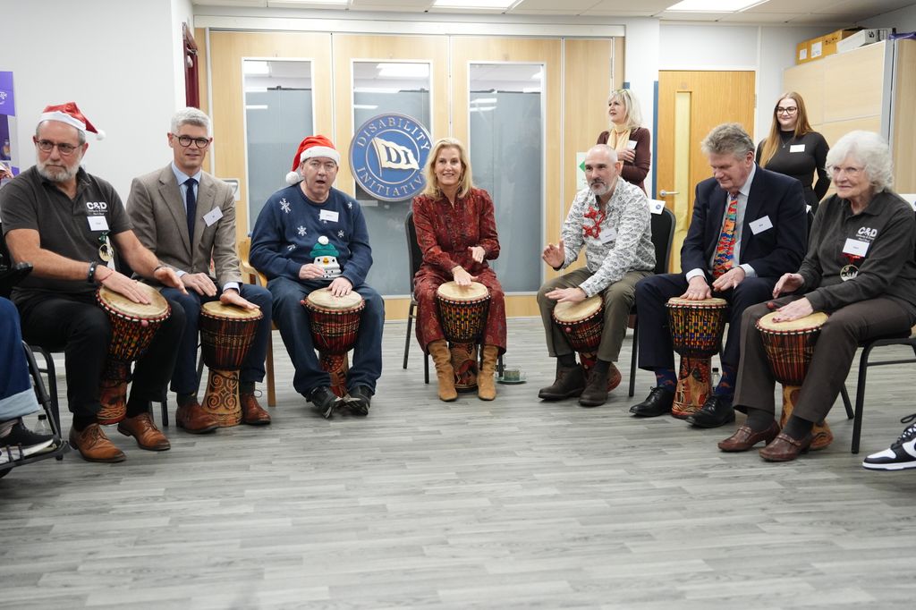 Sophie playing drums