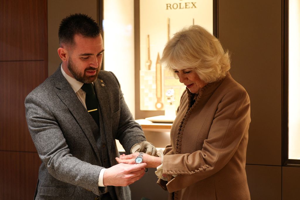 Camilla trying on a Rolex watch