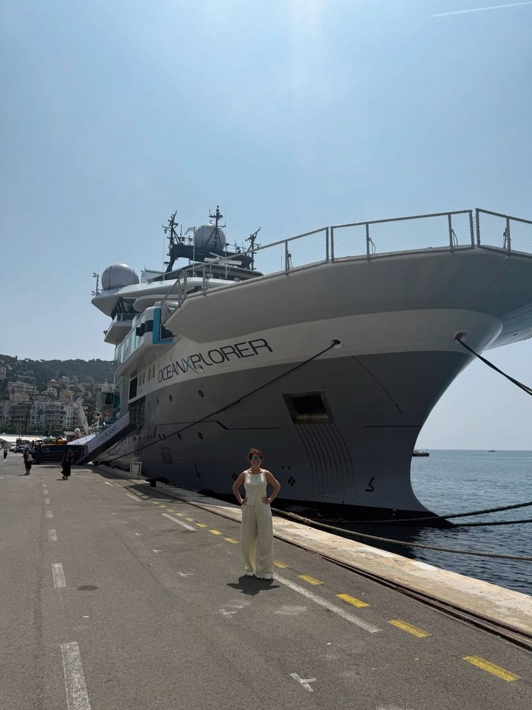 Princess Eugenie standing in front of ship