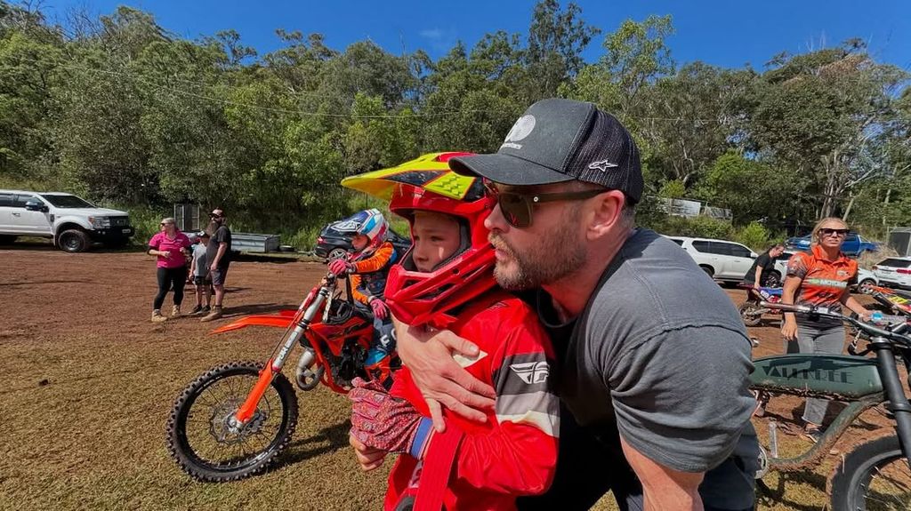 Chris Hemsworth with his son Tristan at a dirt bike race