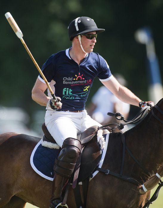 Prince William playing polo