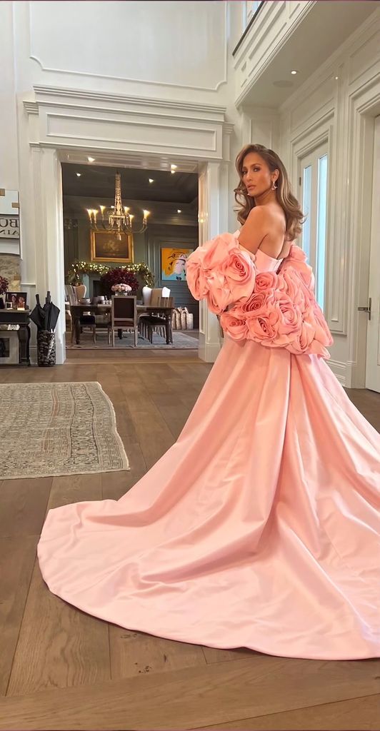 JLo in a pink dress in her hallway