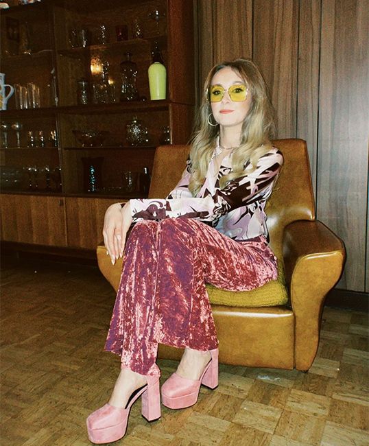 rose ayling ellis in 70s fancy dress pink flares and yellow sunglasses