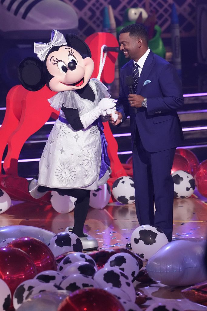 Minnie Mouse stands with Alfonso Ribeiro