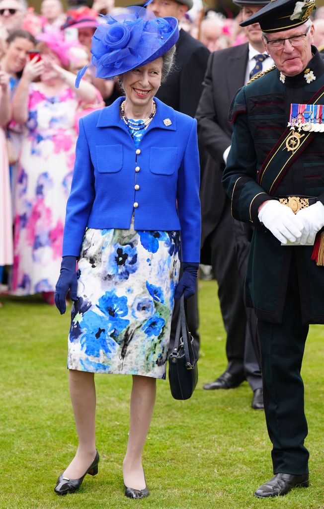 Princess Anne at garden party in blue floral dress and hat