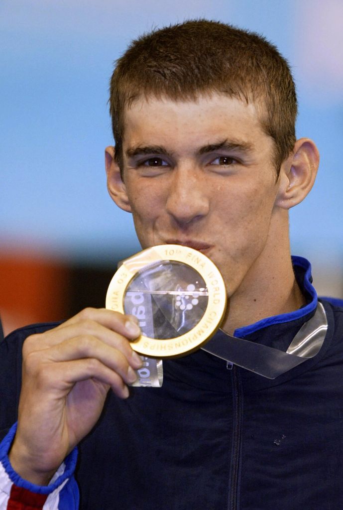 Michael Phelps celebrates after winning the men's 200m butterfly final, 23 July 2003 in Barcelona