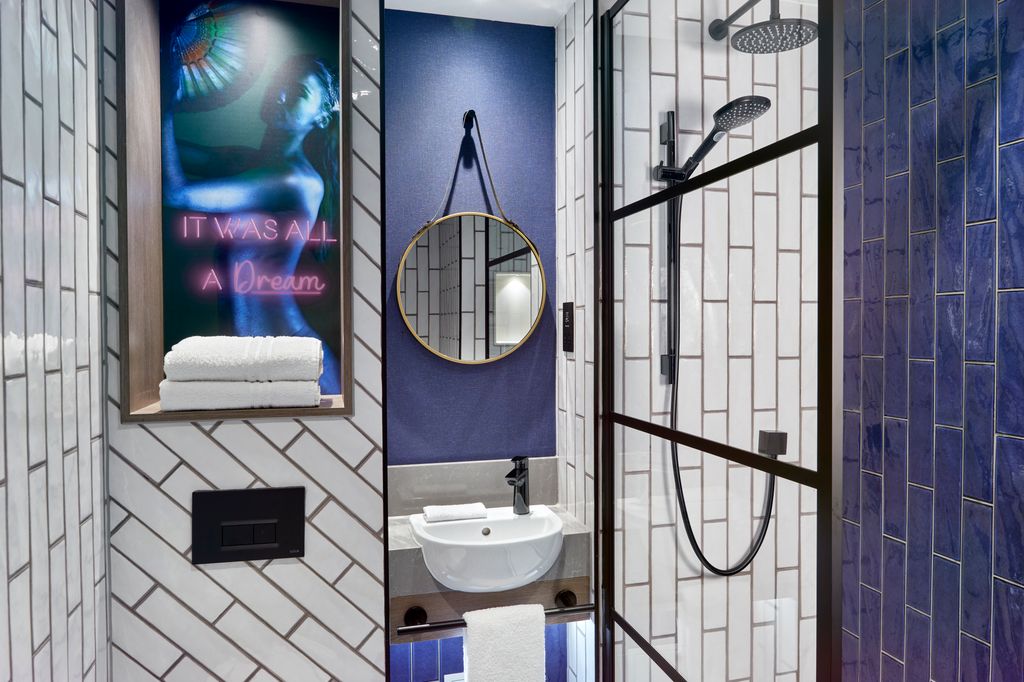 NYX Hotel London Holborn bathroom design with It Was All A Dream wall art 