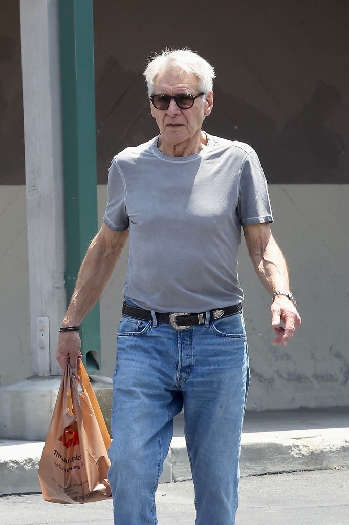 Harrison in gray T-shirt and jeans