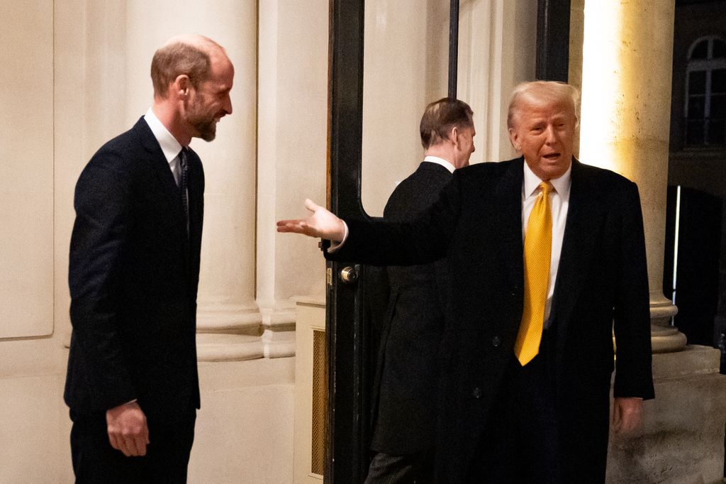 US President-elect Donald Trump (R) gestures towards Britain's Prince William, Prince of Wales (L)