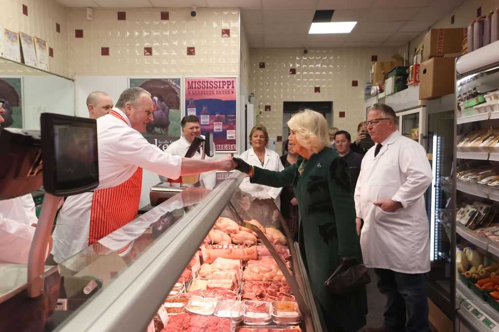 Queen Camilla meets staff at Coffey's Butchers during a visit to Lisburn Road in Belfast
