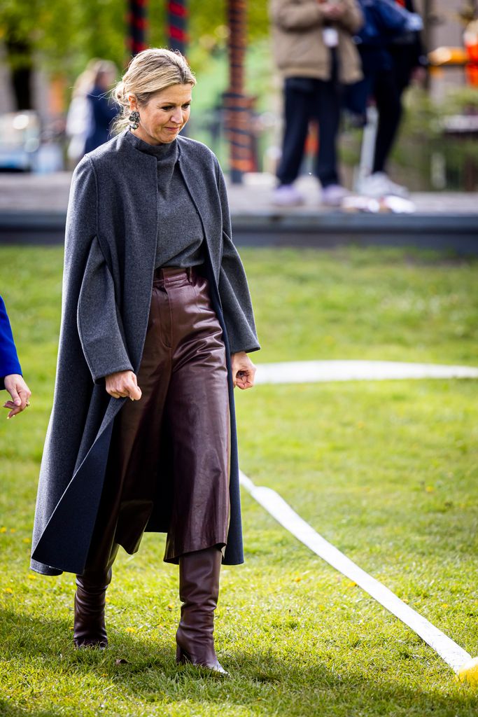 Queen Maxima walking in leather culottes
