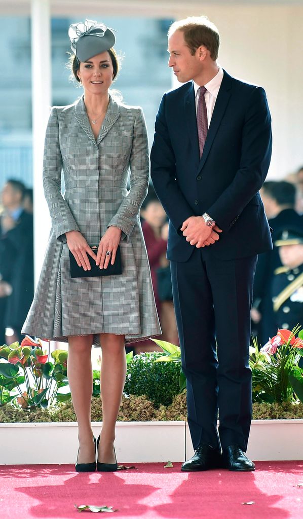 Kate in a grey check coat dress beside william