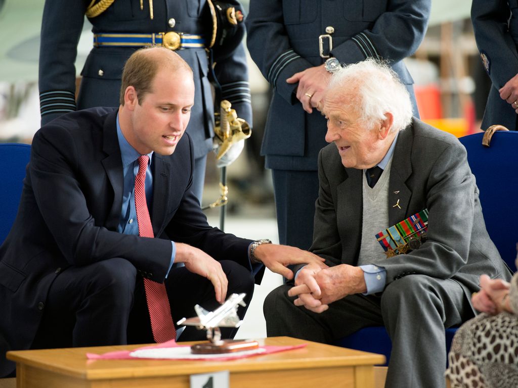 Prince William, Honorary Air Commandant of Royal Air Force Coningsby, chats to Battle of Britain Spitfire pilot Squardon Leader Tony Pickering during a visit to the RAF station 