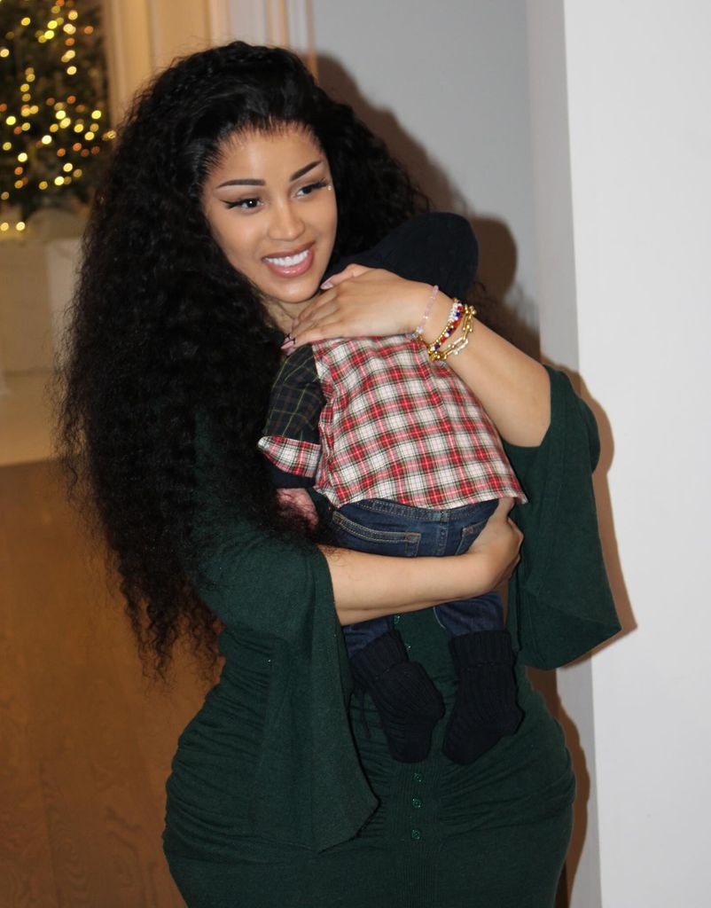 A photo of Cardi B cuddling her newborn baby