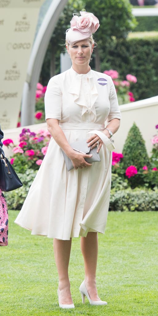 Zara Tindall in pale dress and pink fascinator