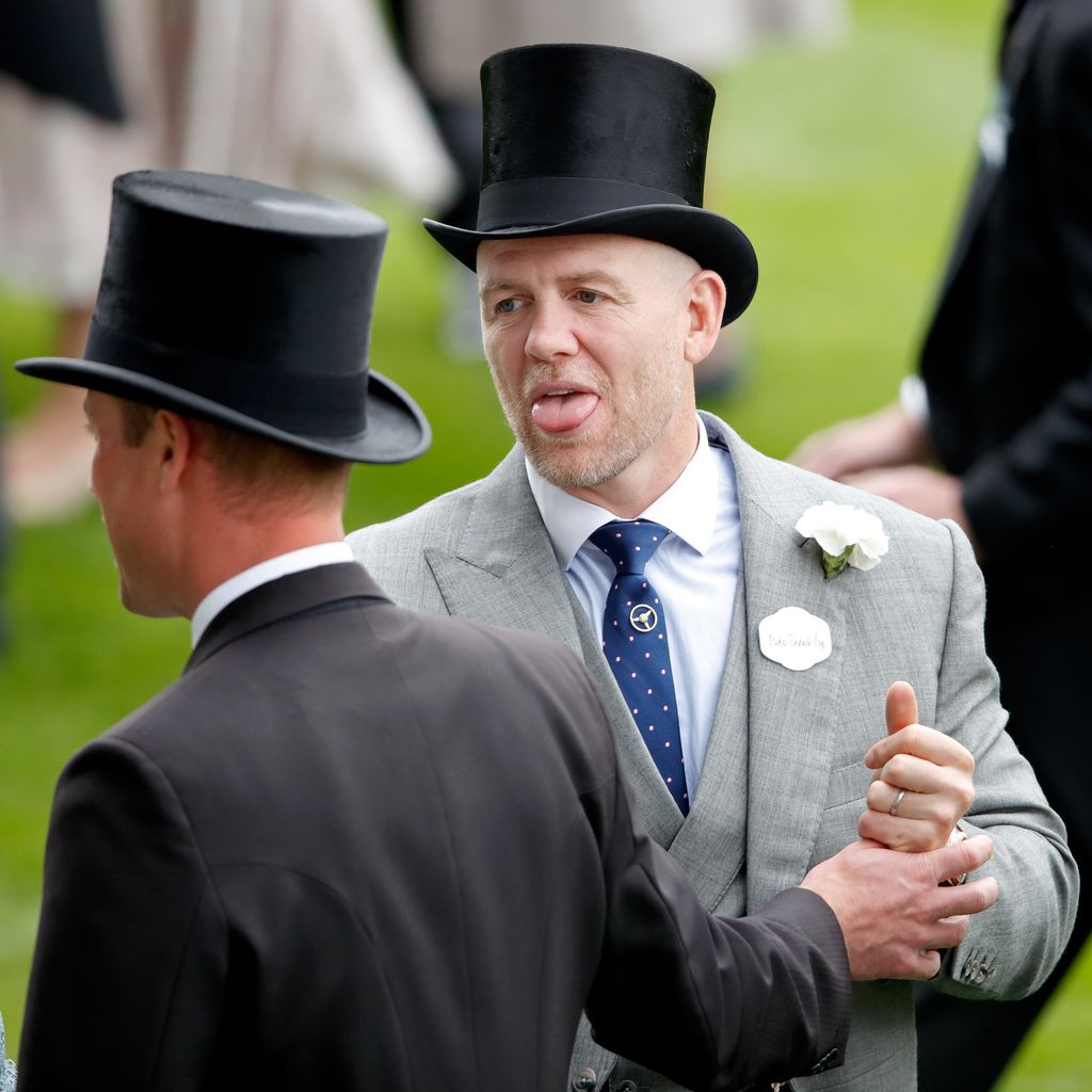 Mike Tindall poking his tongue out at Prince William