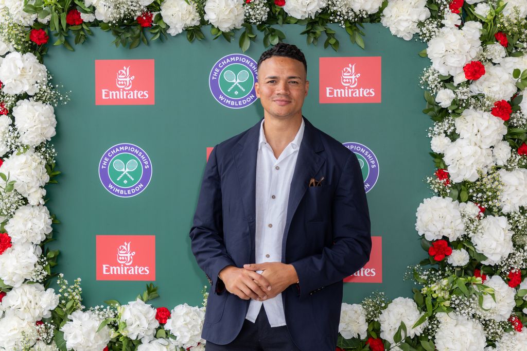 Jermaine Jenas in front of a green background