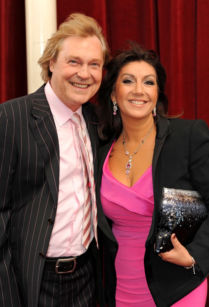 Ed Rothe standing with Jane McDonald