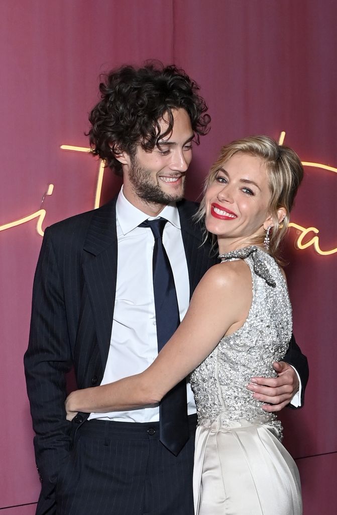 Sienna Miller and Oli Green attend the 2022 Vanity Fair Oscar Party hosted by Radhika Jones on March 27, 2022 in Beverly Hills, California