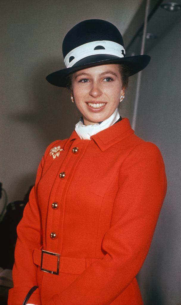 Princess Anne is wearing a smart hat and colorful red coat in the afternoon to perform the opening ceremony of the new Police Cadet Training School.