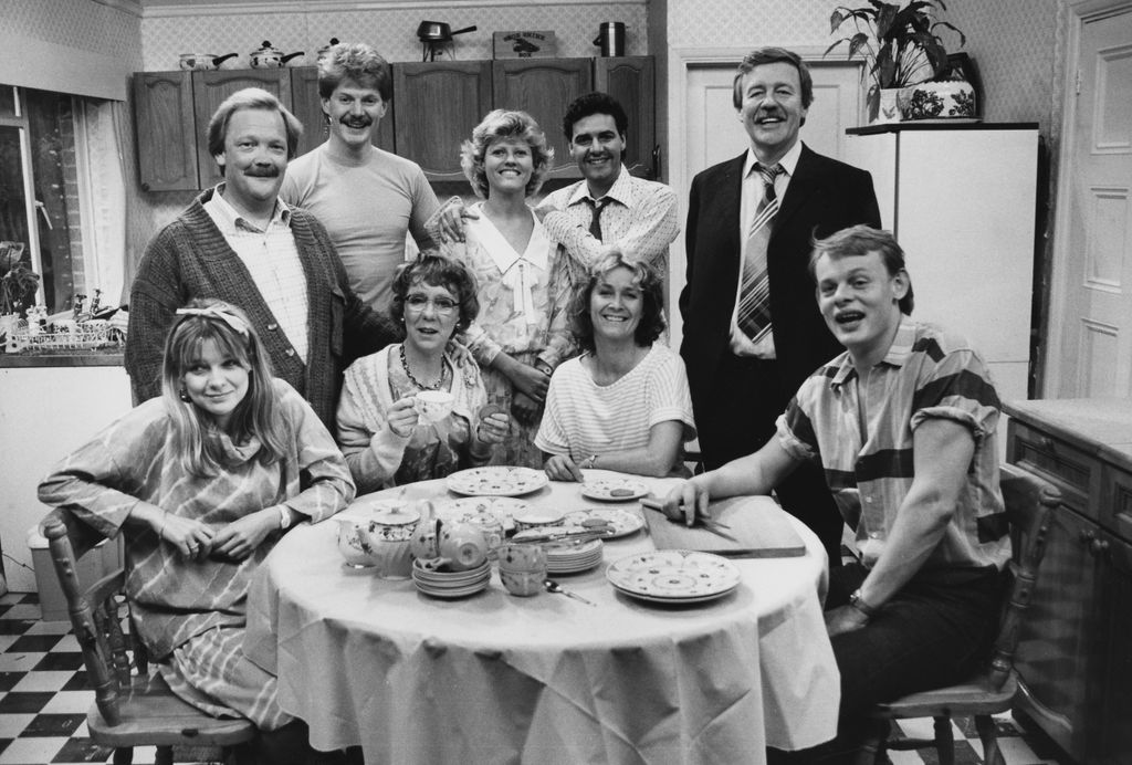 Dee Sadler, Michael Sharvell-Martin, Stephen Watson, Marcia Warren, Beverley Adam, Daniel Hill, Patricia Garwood, William Gaunt and Martin Clunes, pictured on the set of BBC television show 'No Place Like Home' in 1985