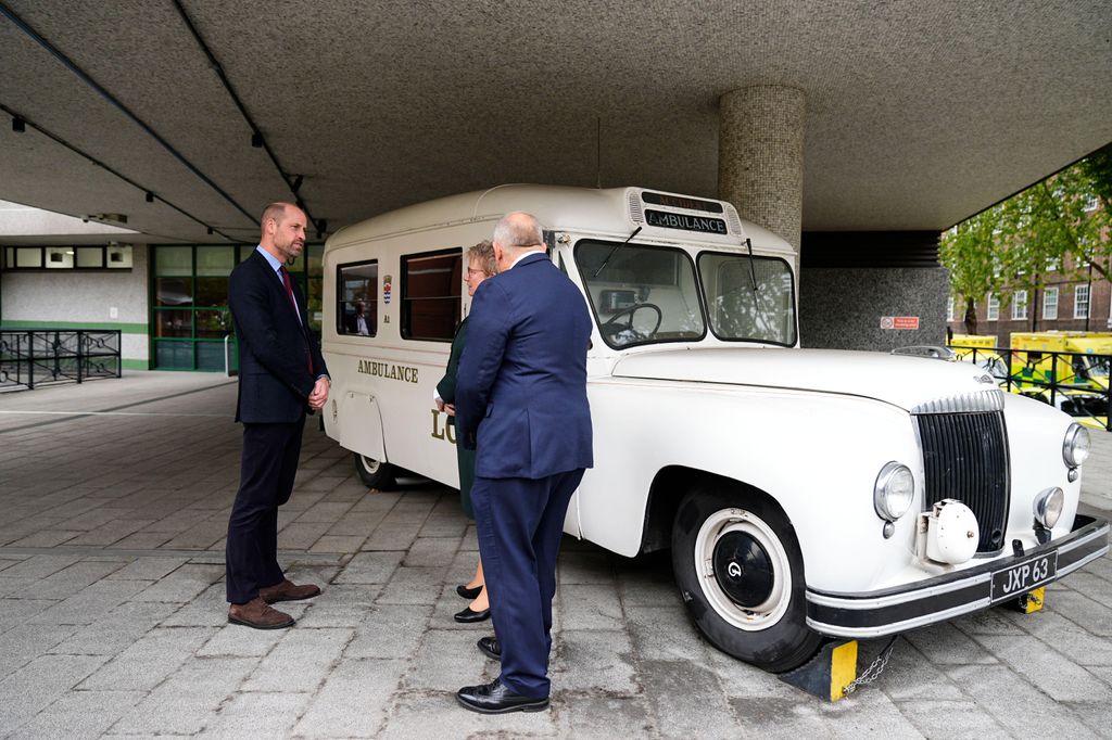 The Prince of Wales speaks with Andy Trotter chair of London Ambulance Service NHS Trust and chief paramedic Pauline Cranmer (centre)