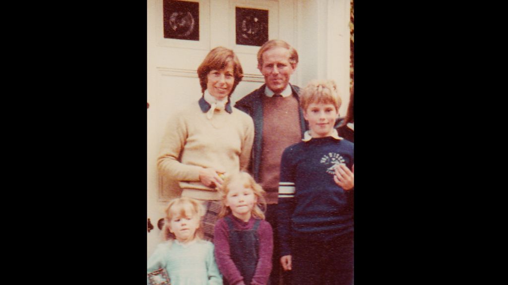 An old family photo featuring a family-of-five