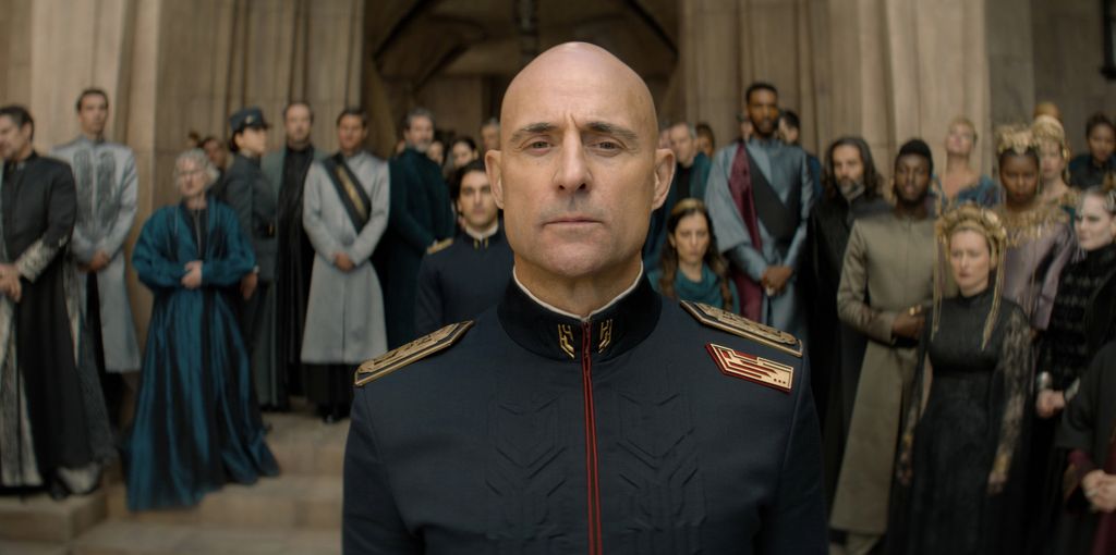 Mark Strong standing in front of a crowd in a scene from Dune: Prophecy