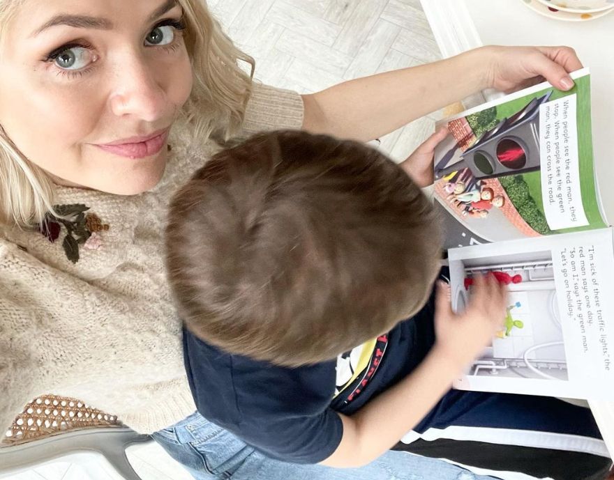Holly Willoughby reading with her son