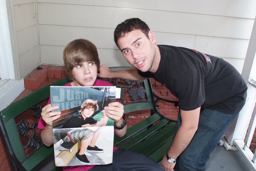 Justin Bieber and Scooter Braun pose for a portrait on the set of the music video One Less Lonely Girl in 2009