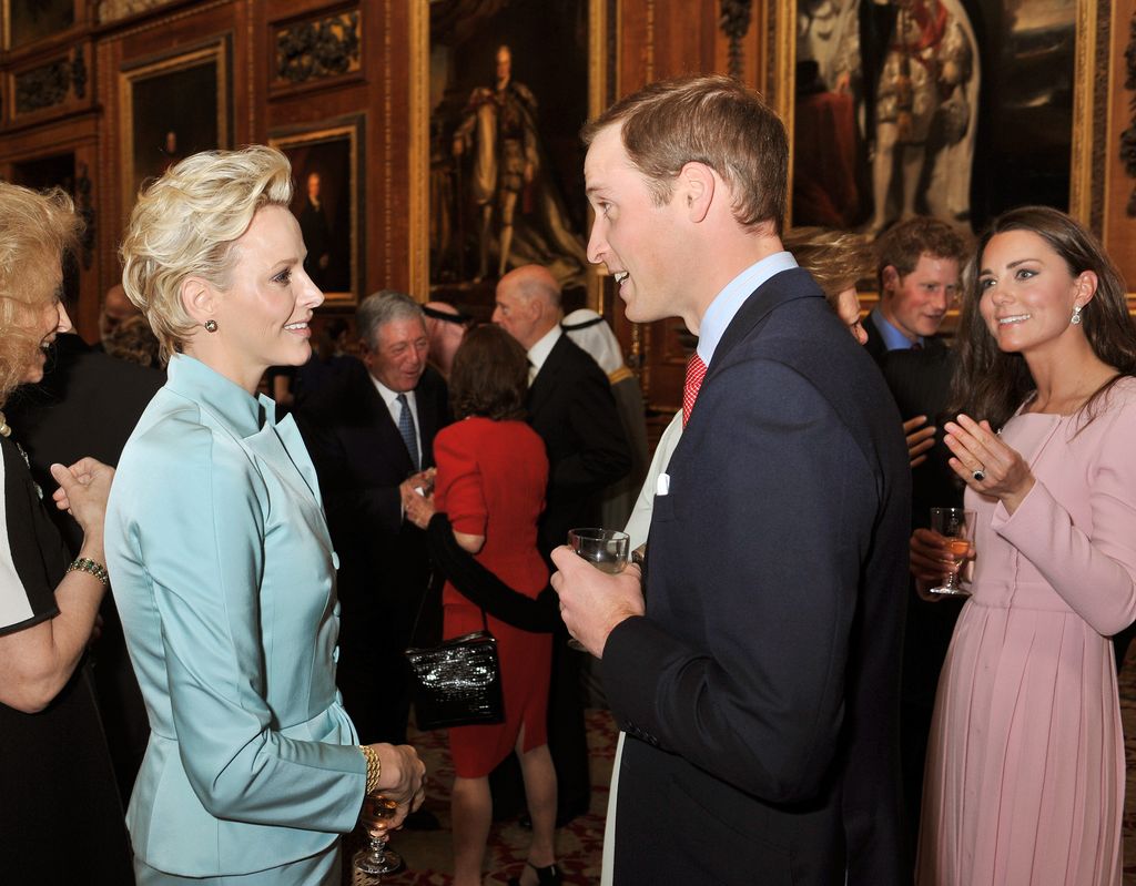 Prince William, Duke of Cambridge and Catherine, Duchess of Cambridge chat to Princess Charlene of Monaco