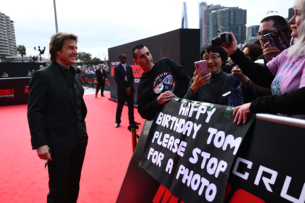 Tom Cruise poses with fans during the Australian Premiere of "Mission: Impossible - Dead Reckoning Part One" presented by Paramount Pictures and Skydance at ICC Sydney on July 03, 2023, in Sydney, Australia