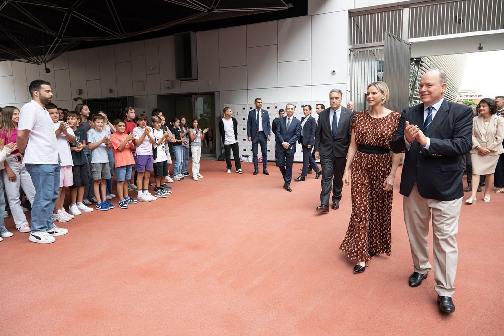 Princess Charlene with albert meeting people