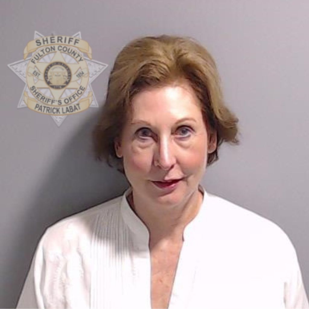 In this handout provided by the Fulton County Sheriff's Office, attorney Sidney Powell poses for her booking photo on August 23, 2023 in Atlanta, Georgia. Former President Donald Trump and 18 others facing felony charges in the indictment related to tampering with the 2020 election in Georgia have been ordered to turn themselves in by August 25
