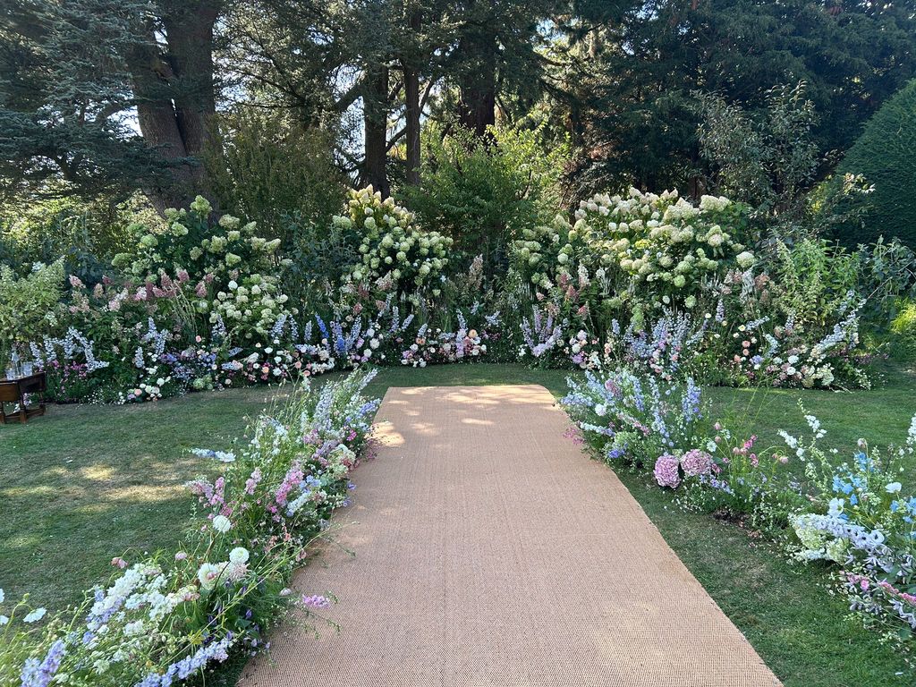 Aisle with flowers either side