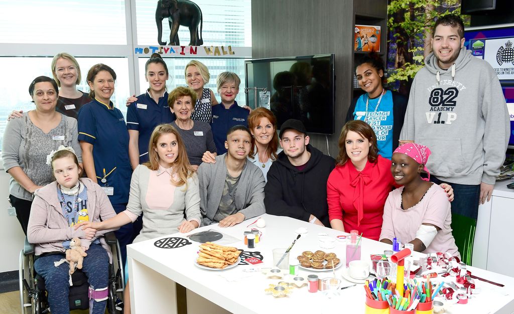 Sarah, Beatrice and Eugenie meeting cancer patients and their families at UCLH in 2016