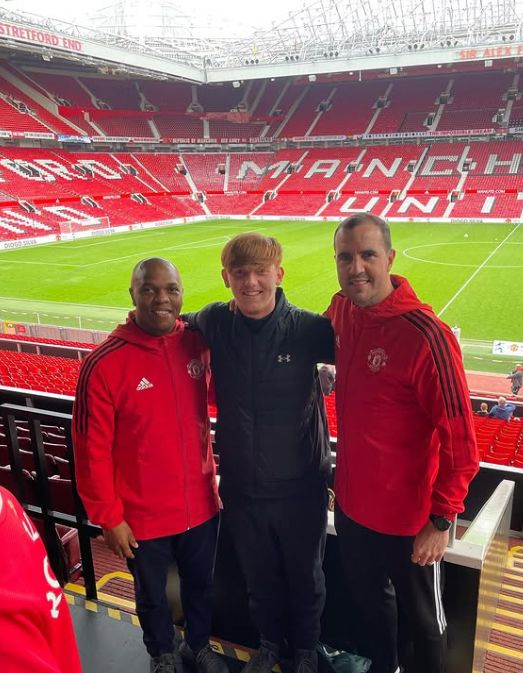 Angry Ginge and two men in a football stadium