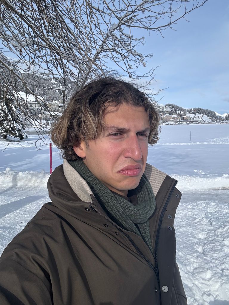 Gstaad Guy in a green scarf and coat