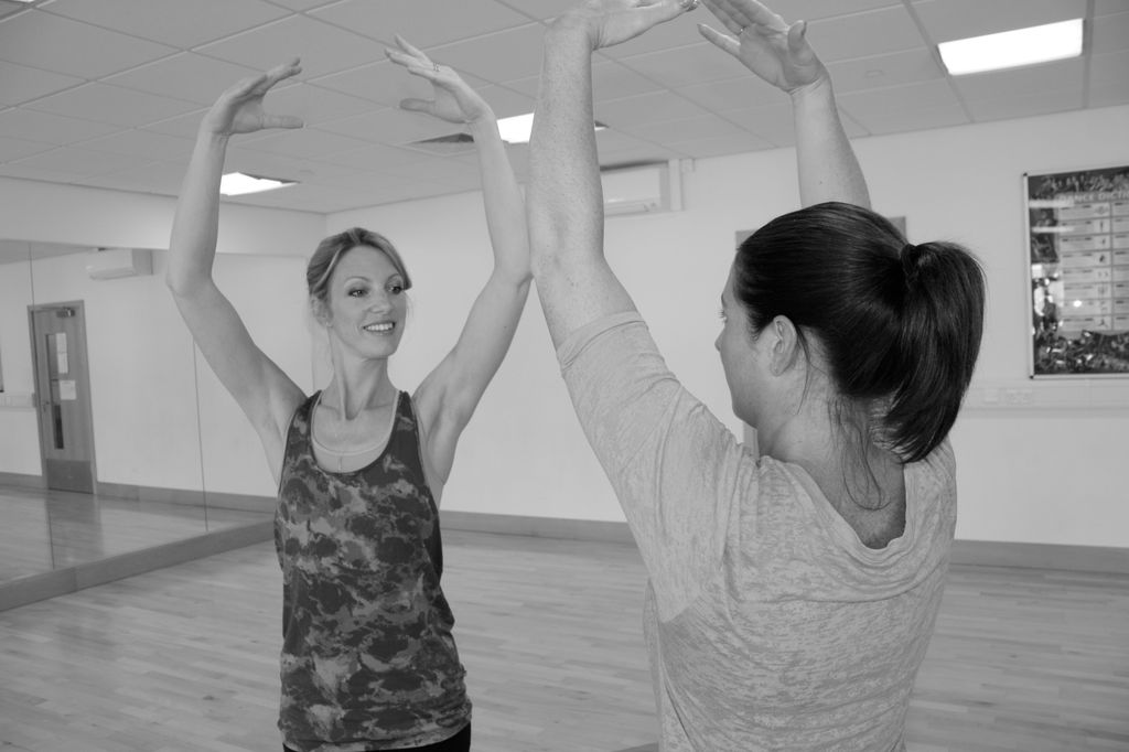 Two women doing ballet in a studio