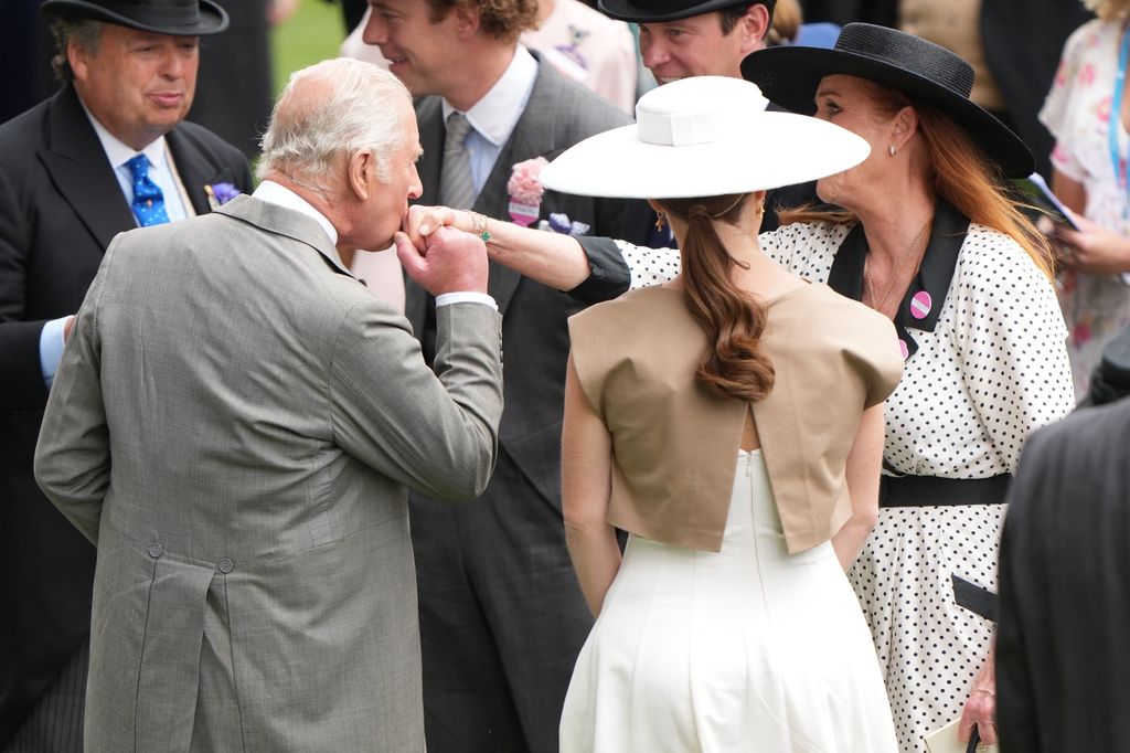 King Charles kisses Sarah Ferguson's hand