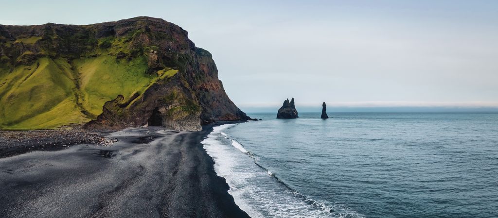 Rynisfjara Black Sand Lava Beach Panorama. 