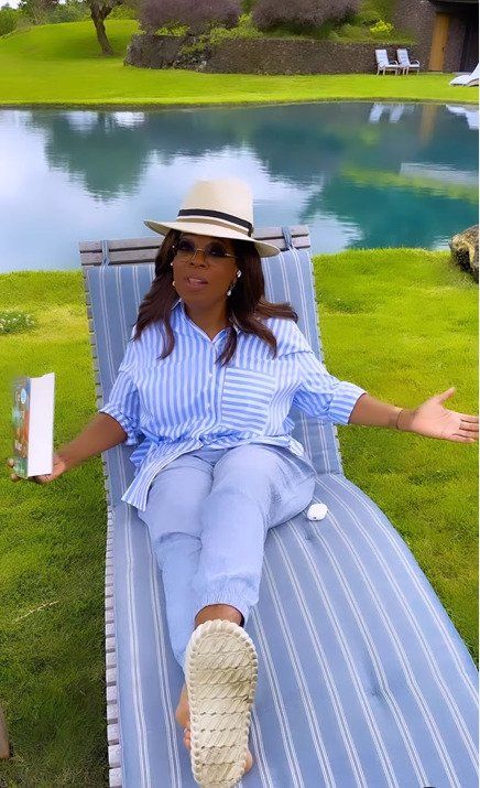 oprah winfrey by pool at home