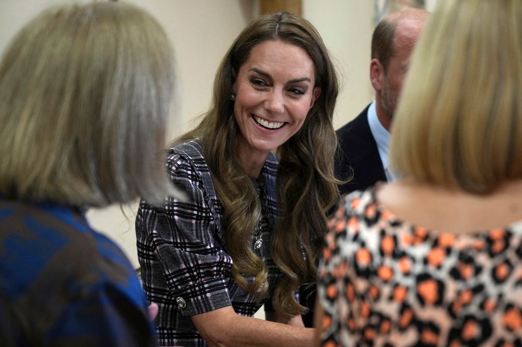 Britain's Catherine, Princess of Wales smiles during a visit with Britain's Prince William, Prince of Wales to the National Federation of Women's Institute (WI) in Sunningdale, west of London on September 8, 2025, to commemorate the three-year anniversary of the death of William's late grandmother Queen Elizabeth II. The Prince will meet with members from Sunningdale WI there and across Berkshire to hear about the work of the WI and how it gives opportunities for women to socialise, learn new skills and engage in community projects. (Photo by Alastair Grant / POOL / AFP) (Photo by ALASTAIR GRANT/POOL/AFP via Getty Images)          