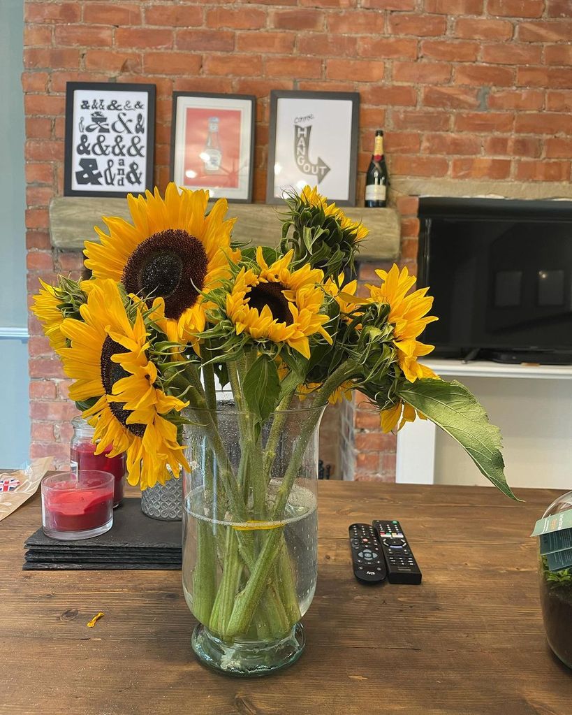 Ellie Warner's sunflower vase on a dining table