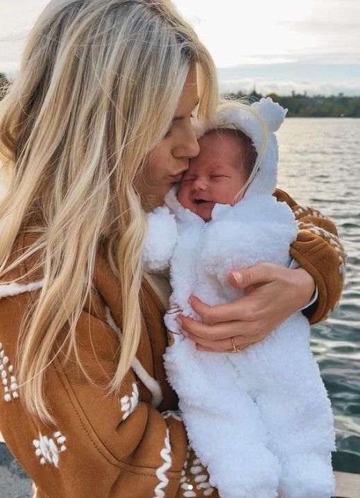 mollie king kissing first born daughter in sleepsuit 
