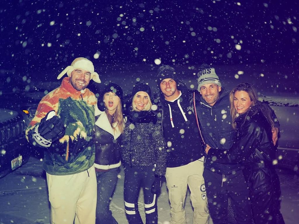 Travis Kelce and Taylor Swift pose with Erin Andrews and husband, and Charissa Thompson and husband 