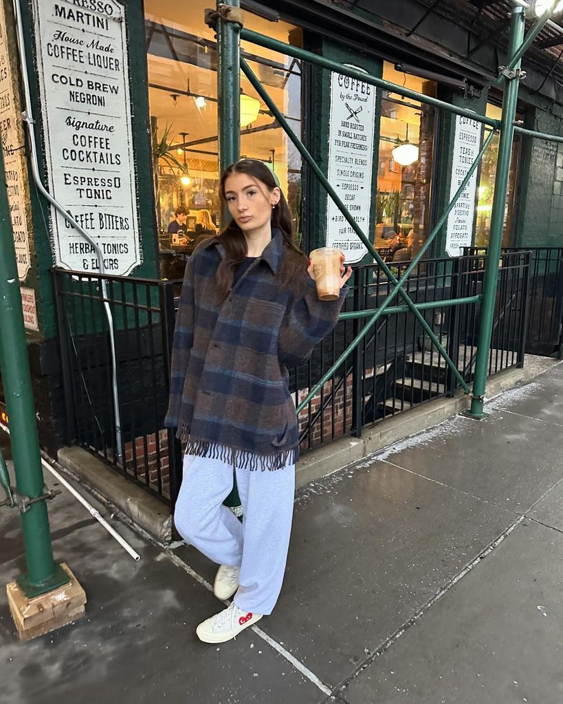 Daisy Boo Oliver in blue jeans and plaid jacket in New York